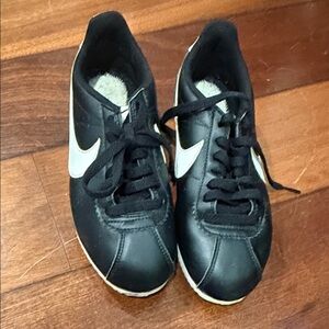 Nike Black Leather Low-Top Sneakers with White Swoosh